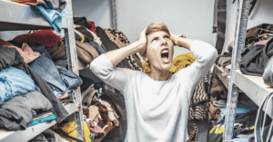 woman screaming in a messy cluttered closet