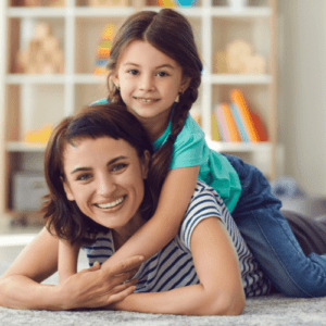happy woman and child in organized playroom